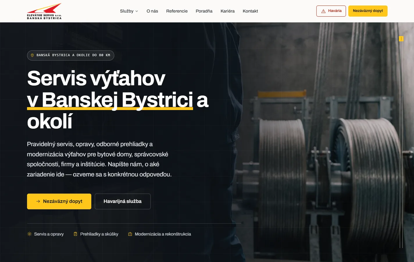 The Elevator Servis homepage: a dark photograph of a lift machine room — steel cable drums and a technician in work trousers — behind white headline type reading "Servis výťahov v Banskej Bystrici a okolí" — lift servicing in and around Banská Bystrica — with the city underlined in yellow. A badge states the service radius is 80 km, a paragraph lists servicing, repairs, inspections and modernisation, and two buttons offer a non-binding enquiry or the emergency line.